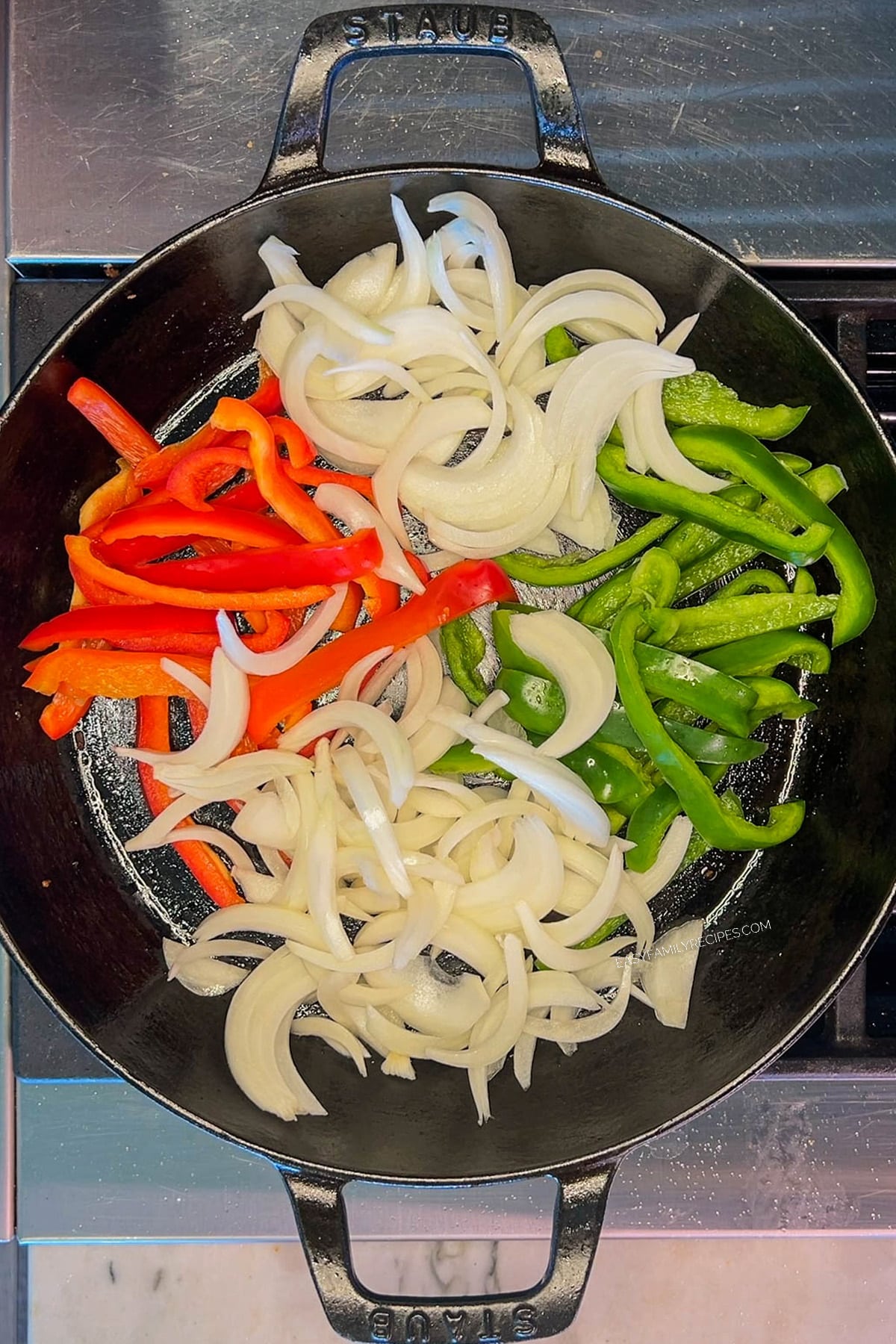 Step 3 of making Chicken Fajita Bowls - saute the veggies