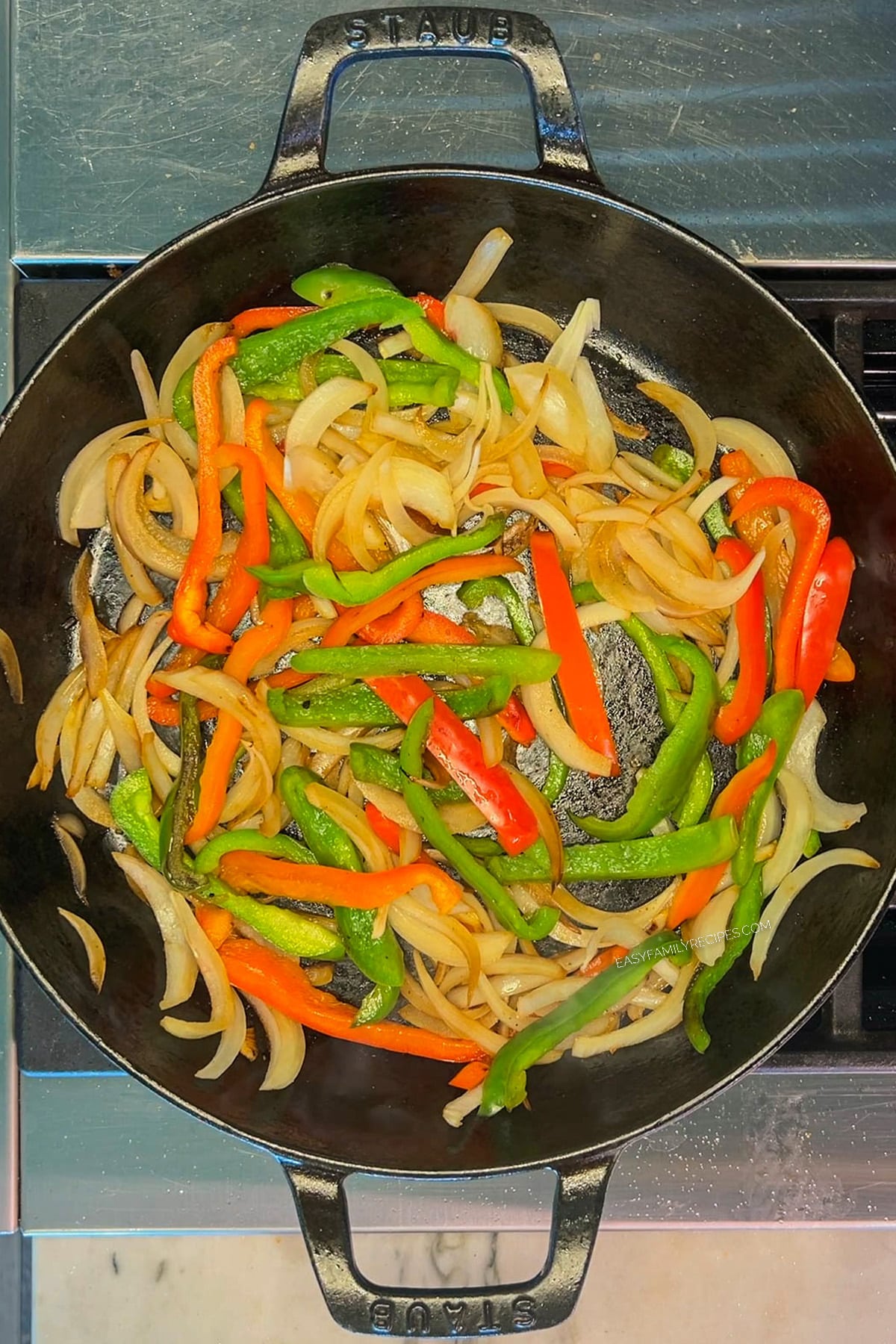 Step 4 of making Chicken Fajita Bowls - saute the veggies