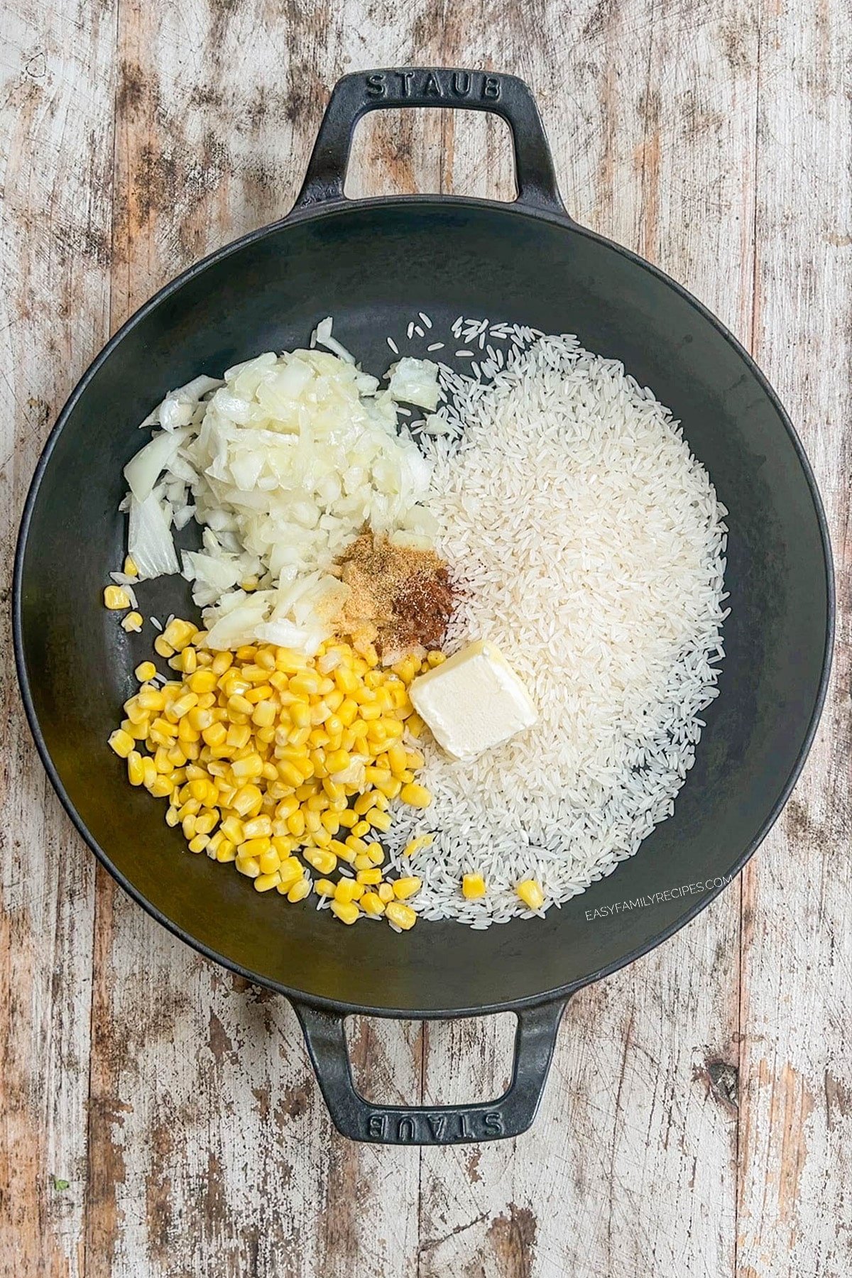 rice, onion, corn, spices, and butter in a skillet.