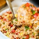 a side view of a bowl of Southwest rice with a spoon.