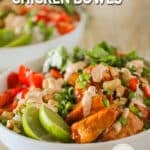 Easy chili crunch chicken bowl assembled in a bowl with dressing drizzled on top.