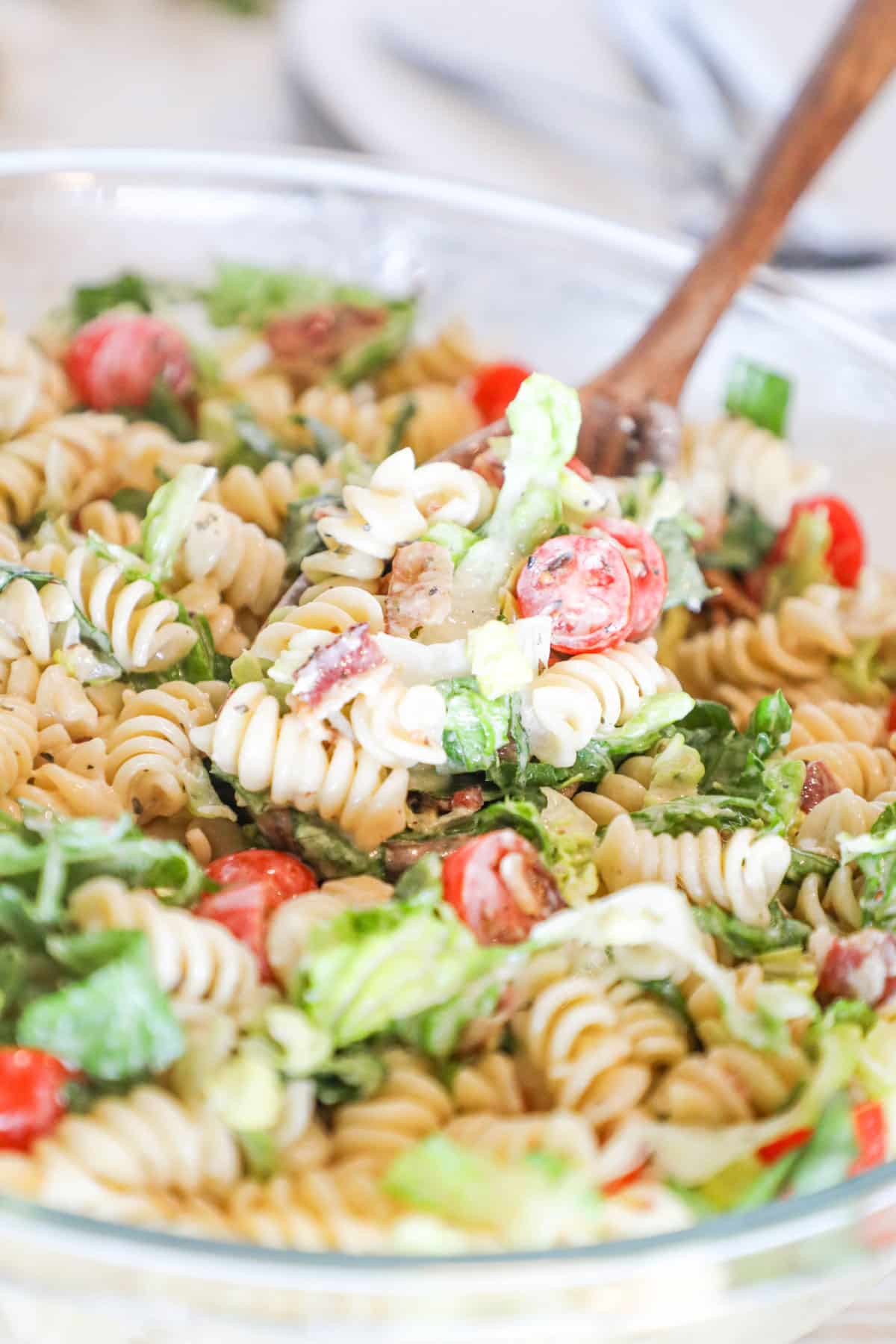 closeup of finished BLT pasta salad in a serving bowl.