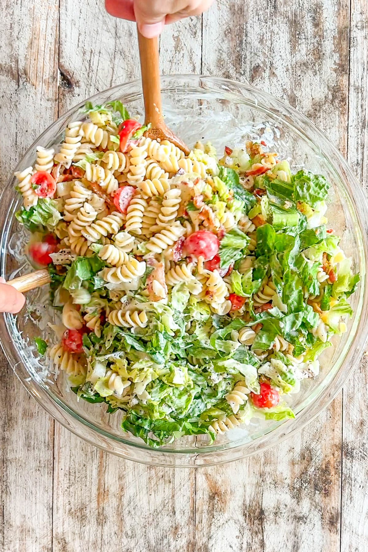 above image of finished pasta salad in a bowl. 