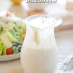a dressing container half full of creamy Italian dressing.