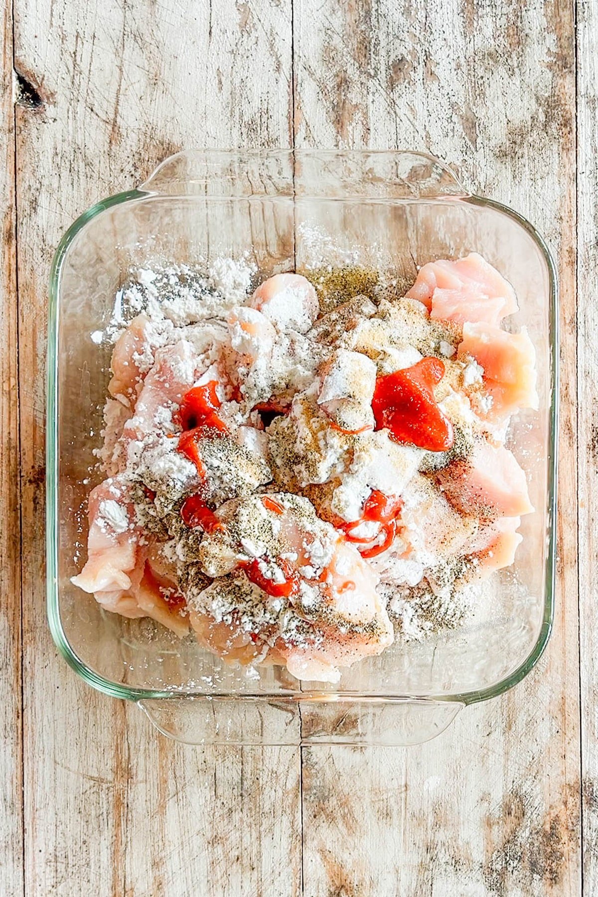 chicken topped with seasonings.