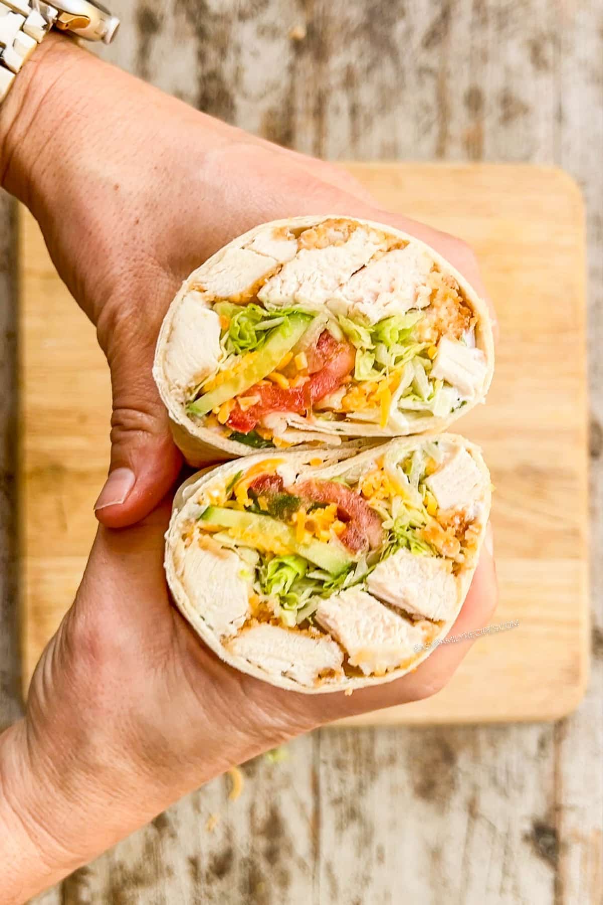 Step 4 for making chicken tortilla wraps: Cut in half and serve.