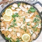 Top view of creamy lemon chicken orzo in a skillet with a wooden spoon. Slices of lemon and herbs garnish the top. The text reads, "Creamy Lemon Chicken Orzo"