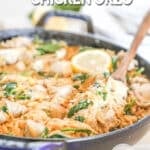Creamy Lemon Chicken Orzo in a skillet with a wooden spoon and a lemon slice on top. The text reads, "Creamy Lemon Chicken Orzo"