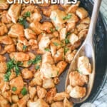 Honey BBQ Chicken Bites in a black skillet with a wooden spoon stirring them. The text reads, "Honey BBQ Chicken Bites"