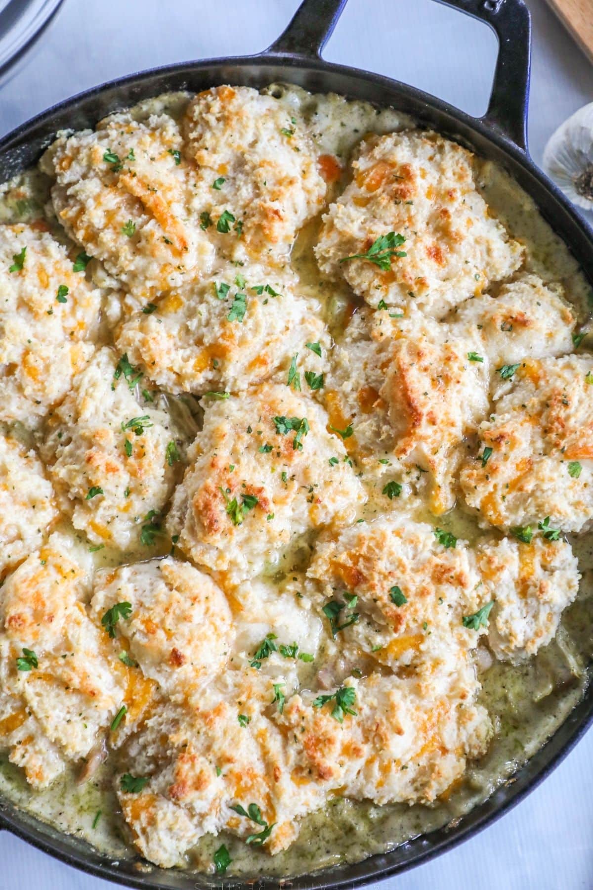 cast iron skillet of cheddar bay biscuit chicken pot pie