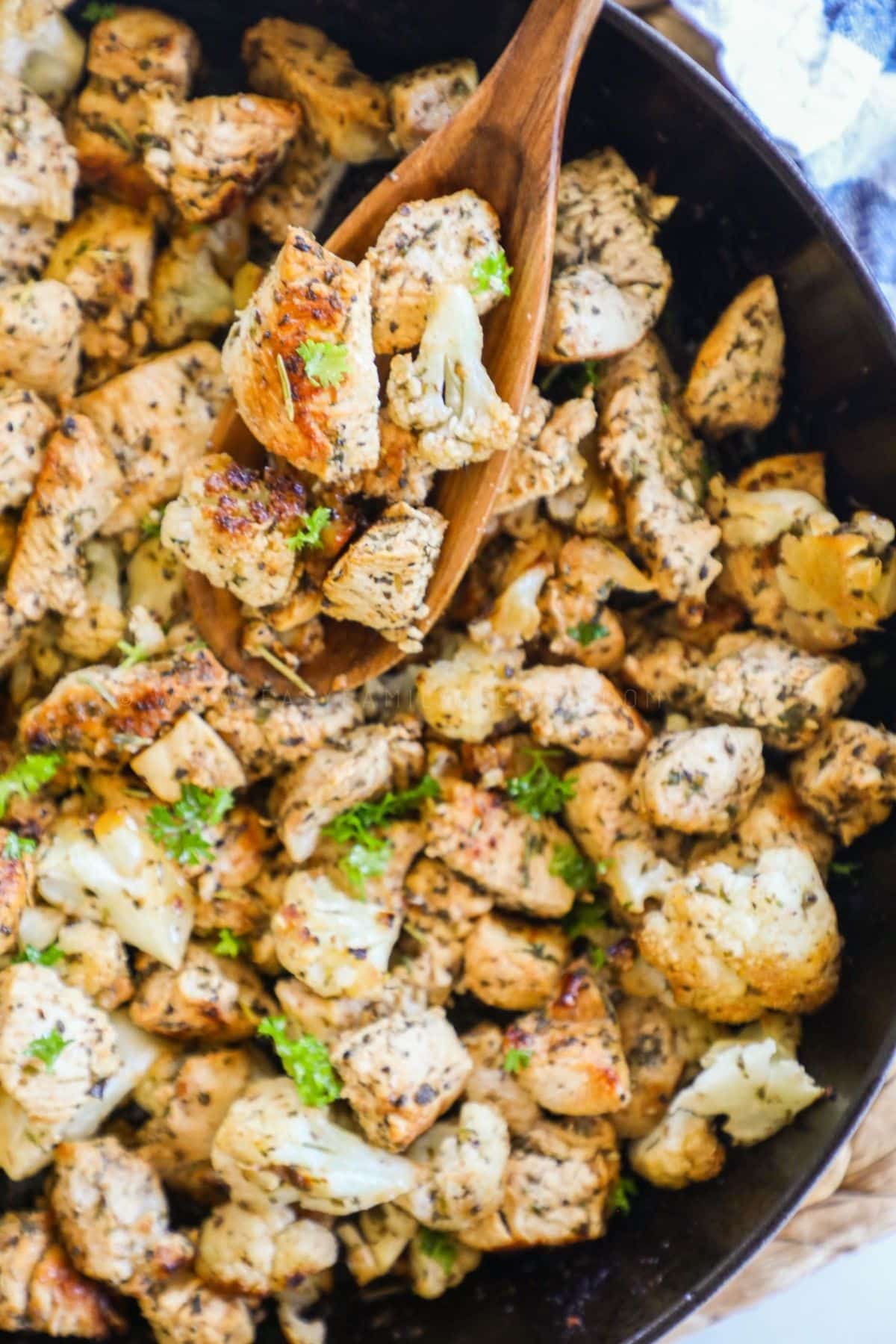 greek chicken and cauliflower bites in a skillet