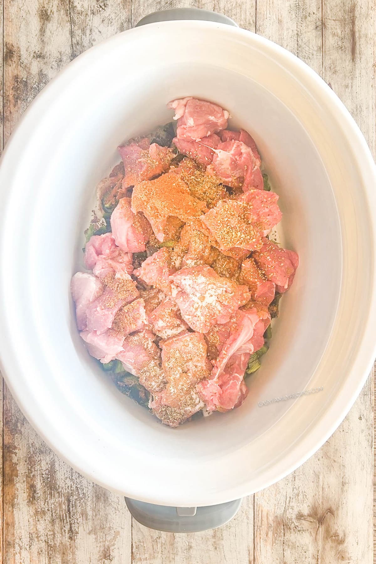 Step four for making Crockpot Pork Chile Verde: Add the seasonings.