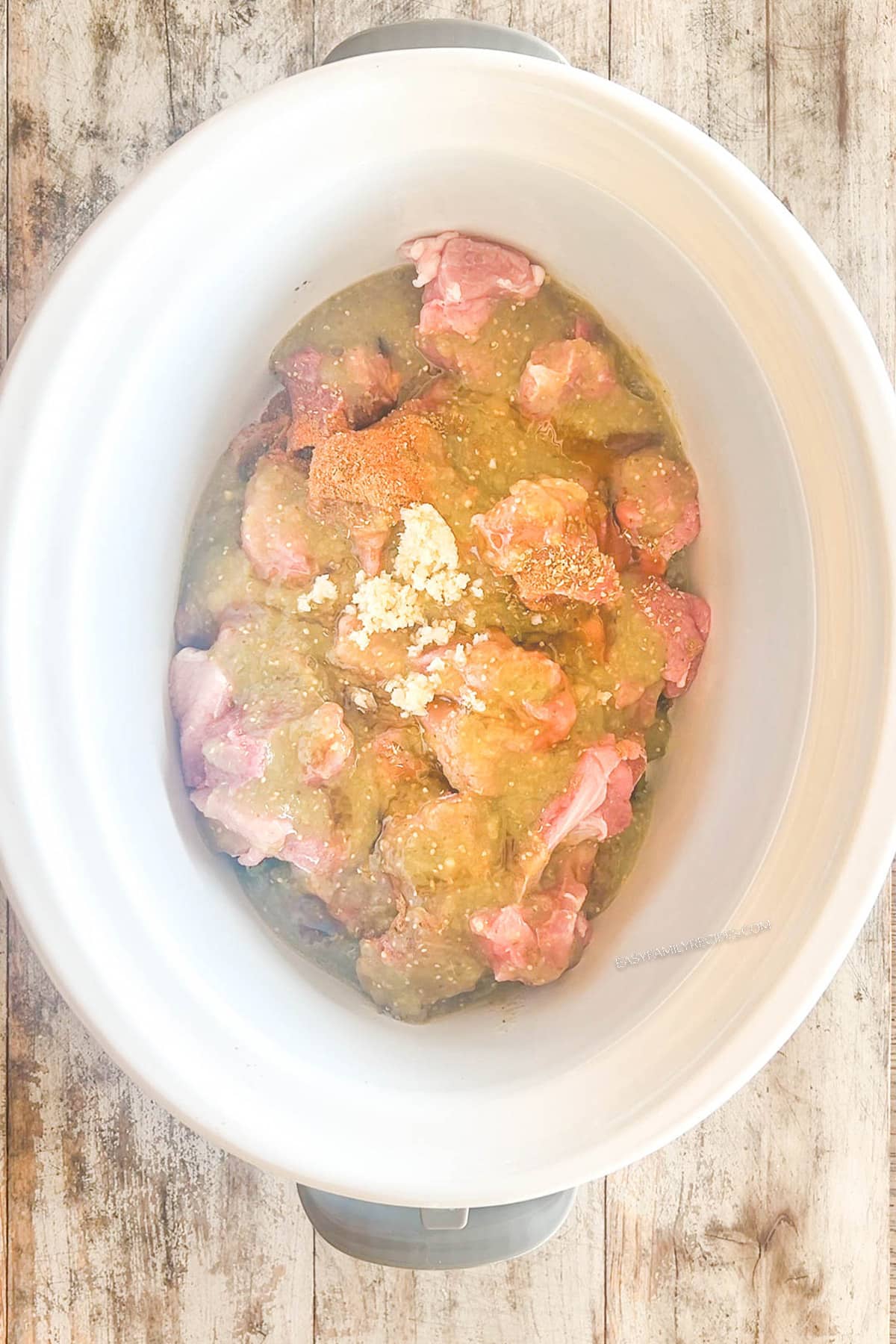 Step 5 for making Crockpot Pork Chile Verde: Add the garlic.