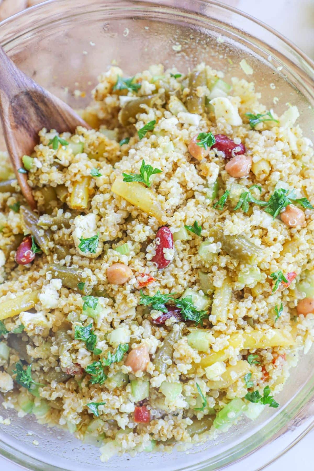 4 bean quinoa salad in a clear bowl