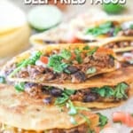 finished beef fried tacos on a plate.