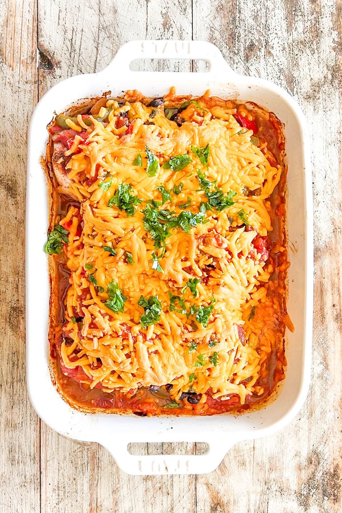 A top view of freshly baked Mexican Chicken Bake in a white casserole.
