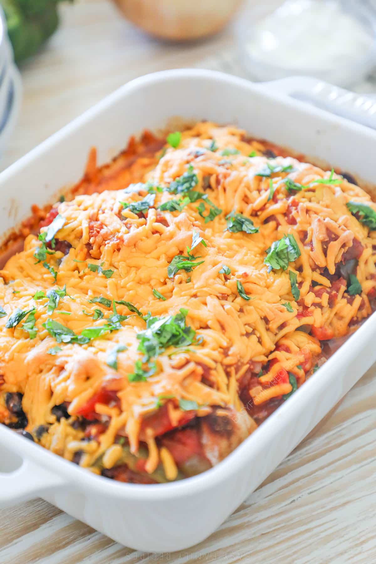 A white baking dish full of Mexican Chicken Bake