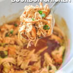 Bourbon Chicken being lifted out of a white Crock Pot with a silver spoon. The text reads, “Crockpot Bourbon Chicken”