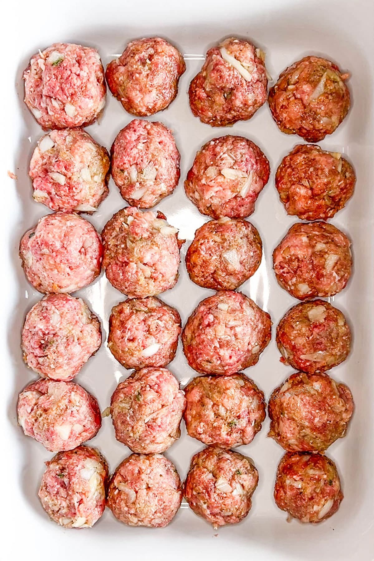 Step 3 for how to make chili cheese meatballs - place meatballs in a casserole dish.