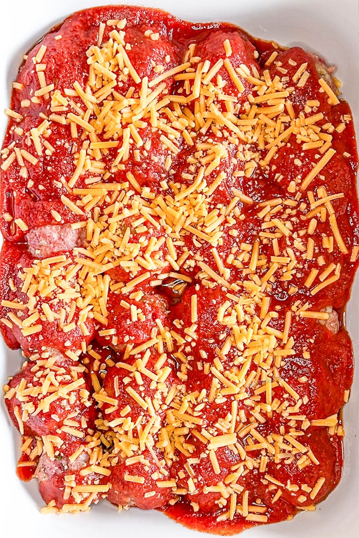 Step 5 for how to make Chili Cheese Meatball Bake - Top with the chili cheese mixture