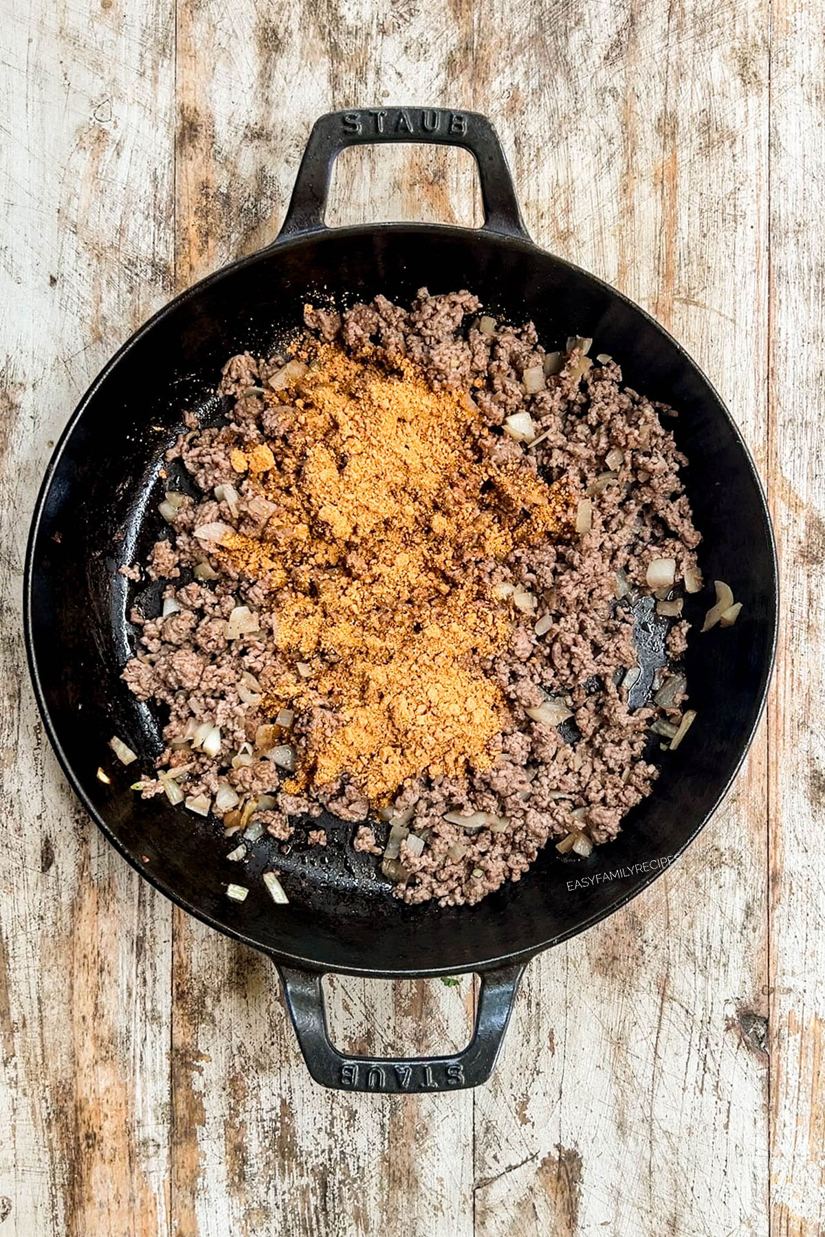 skillet with ground beef and taco seasoning.