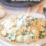 One pot spinach artichoke chicken orzo on a plate.