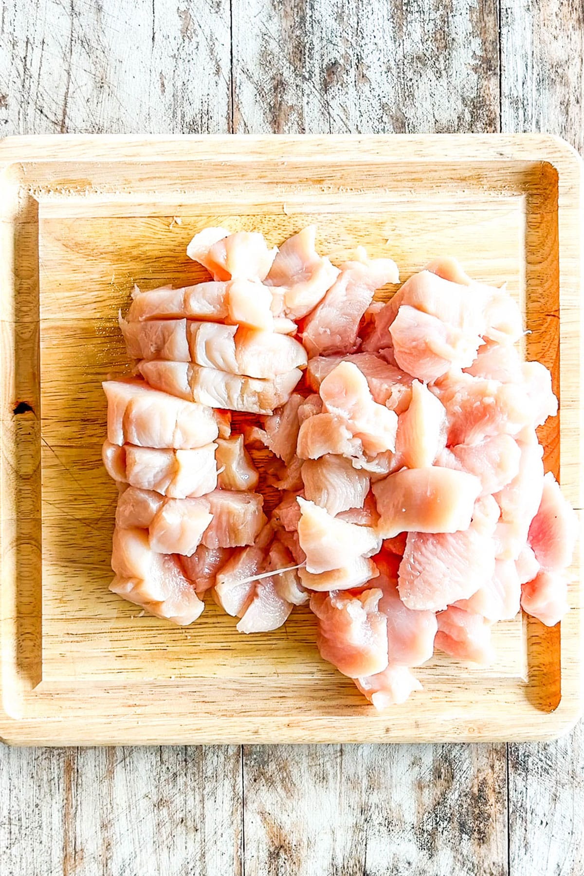 Step 1 for making bang bang chicken: Cut the chicken into bite-size pieces.