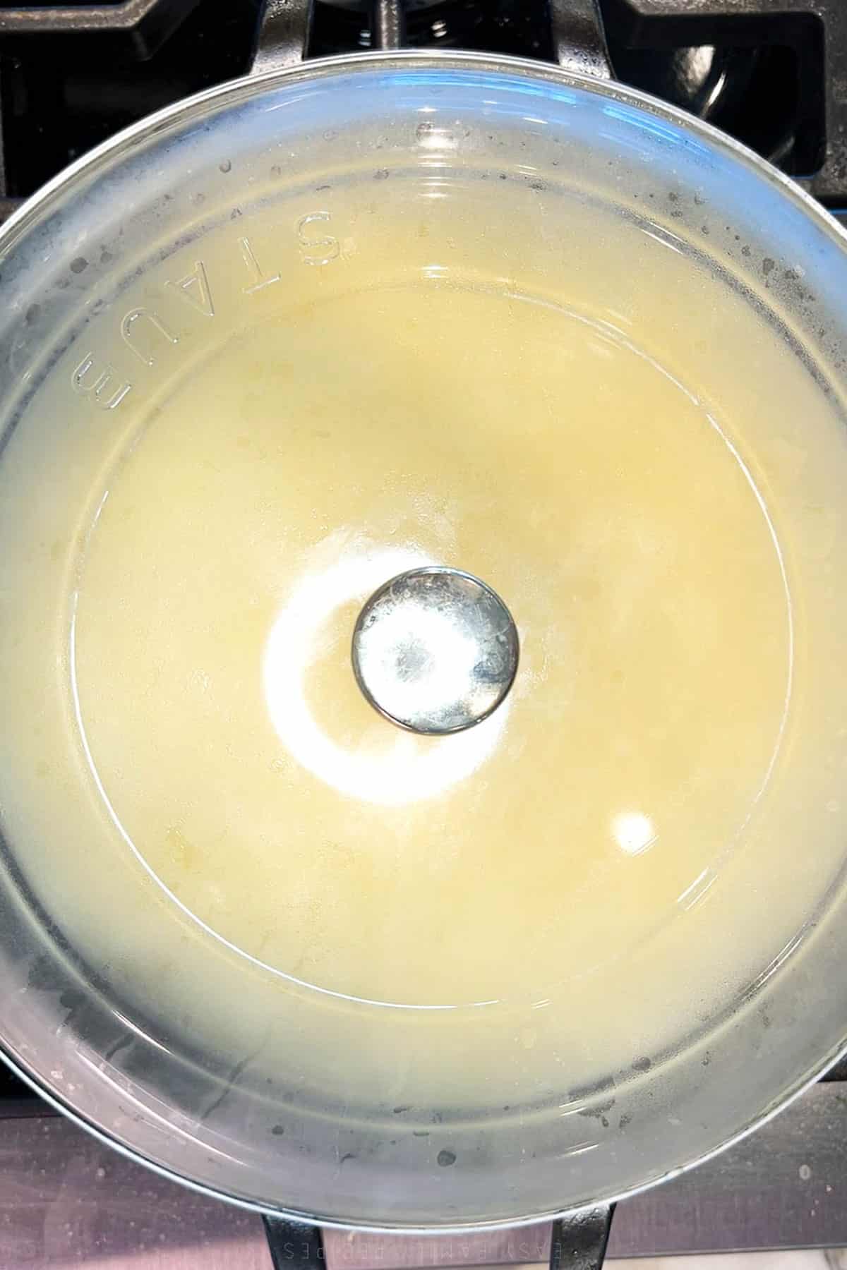 Step two for cooking cheesy grits with eggs