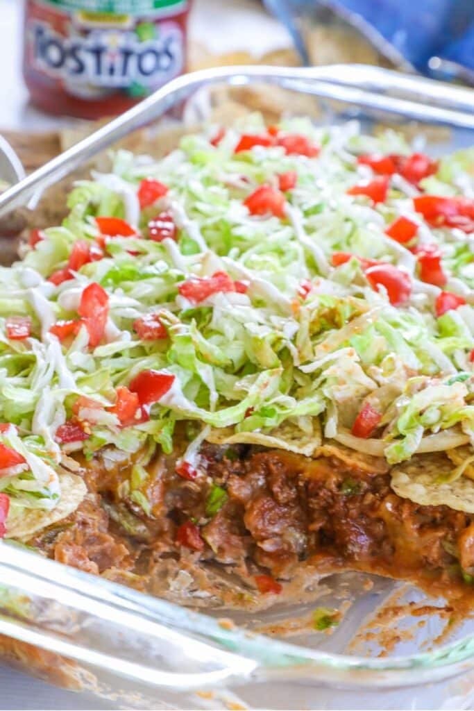 7 layer taco casserole in a clear baking dish