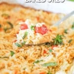 A spoon scoops out a serving of Boursin Baked Orzo in a white casserole dish. The text reads, “Creamy Boursin Baked Orzo”