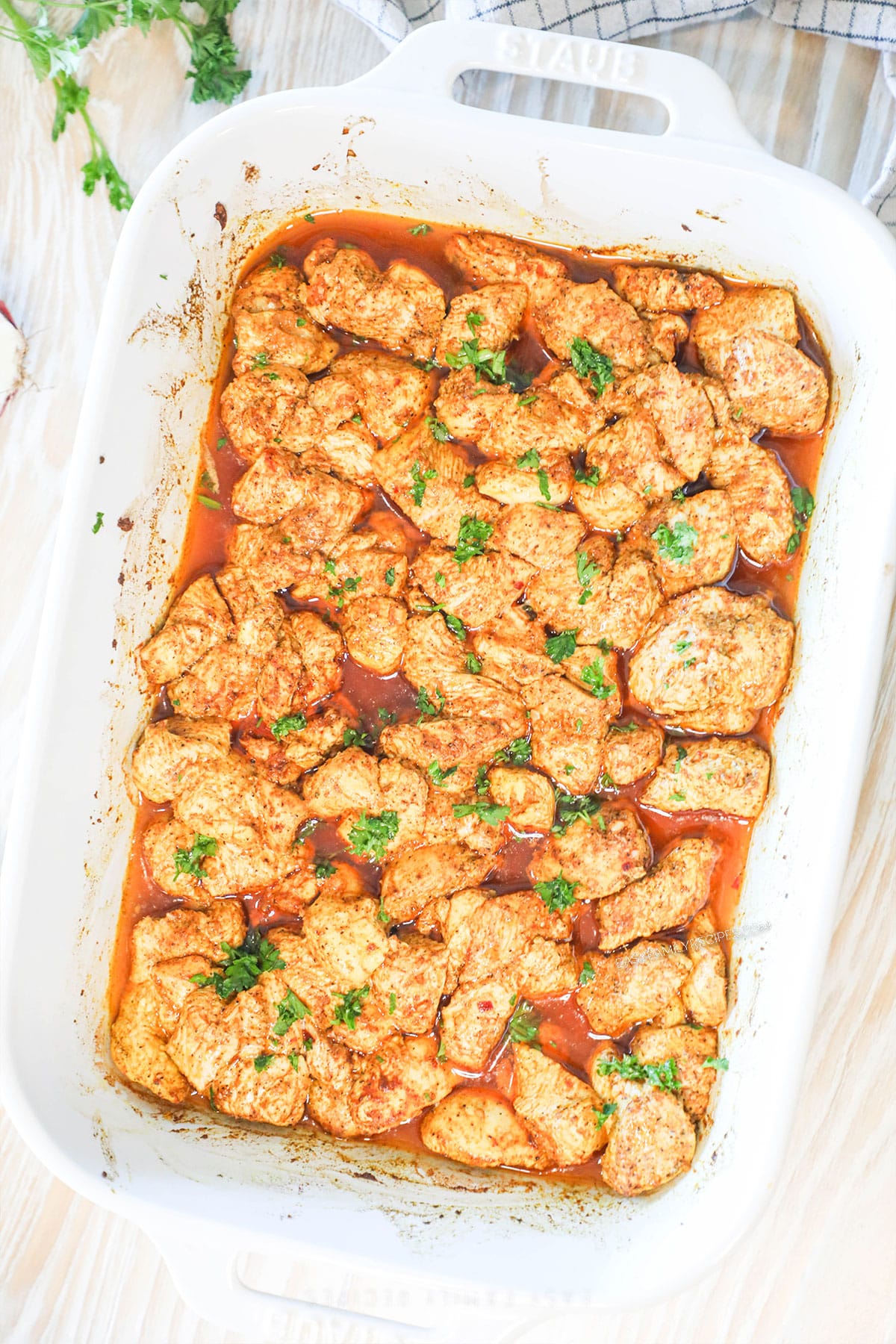 Top view of chicken schwarma bites in a baking dish