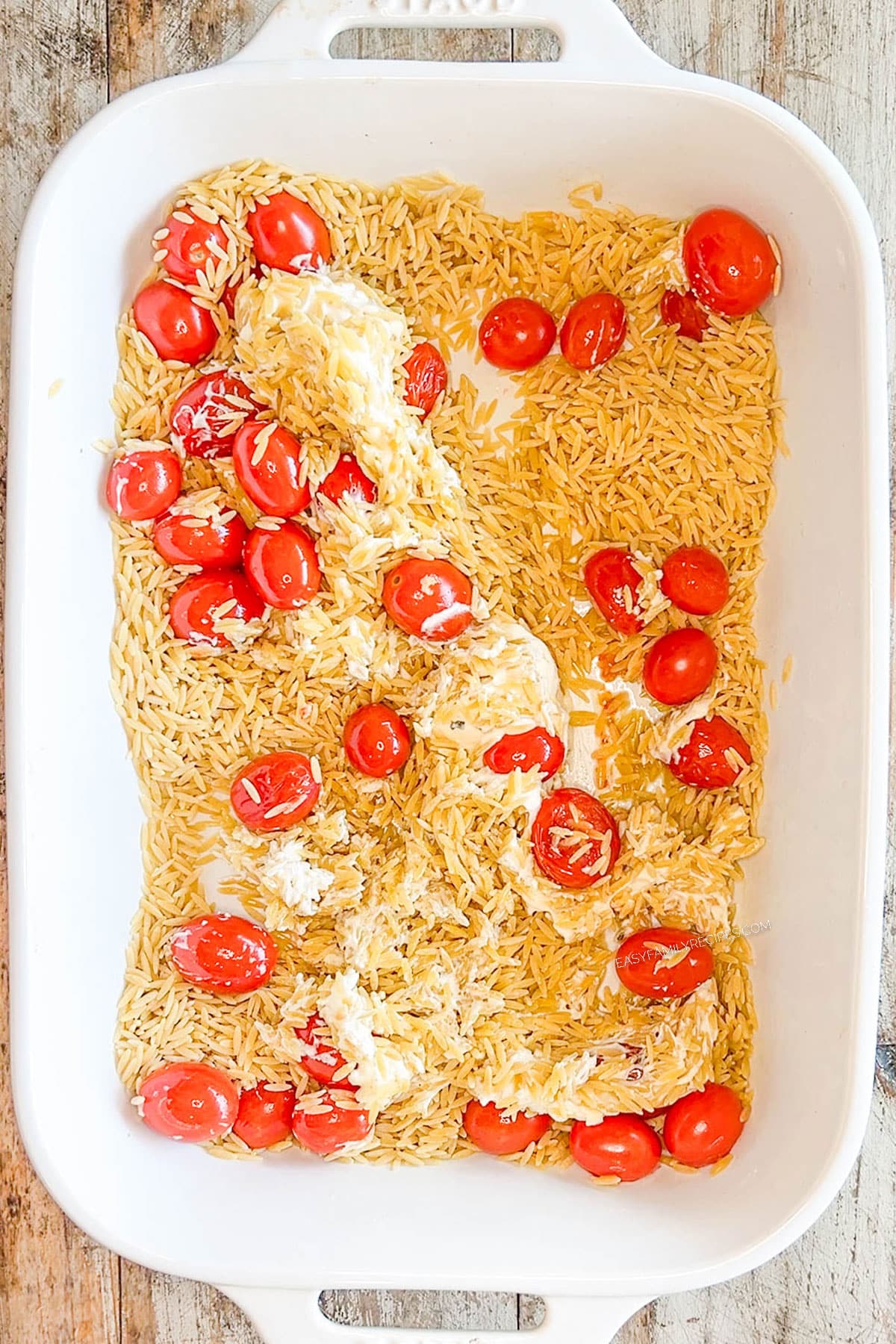 Step 2 for how to make creamy boursin baked orzo: Add broth and orzo