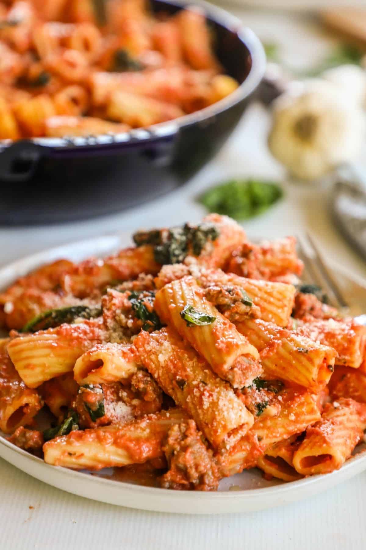 a plate of italian sausage pasta
