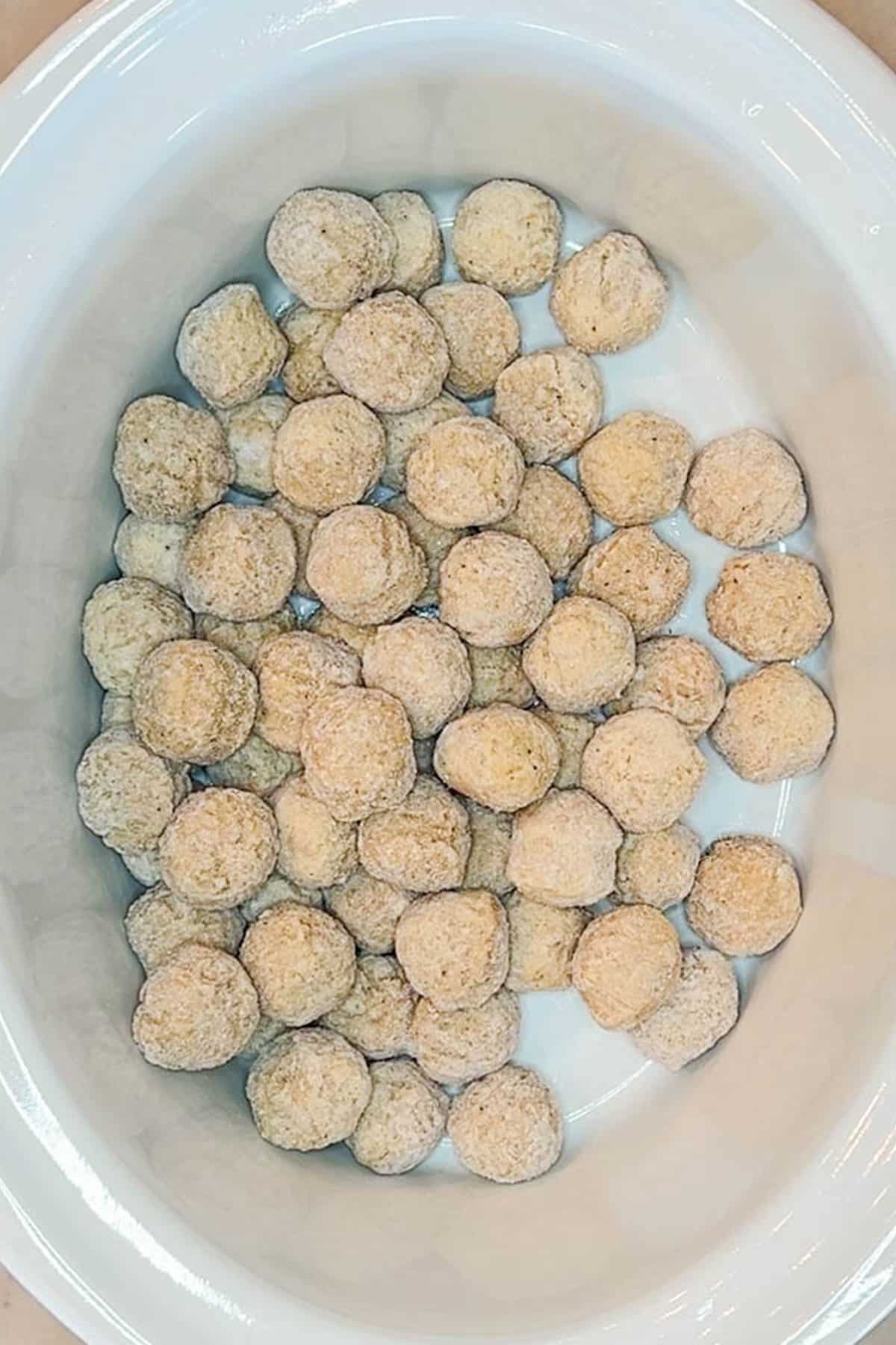 Step 1 for how to make Crockpot Sweet Chili Meatballs - add the meatballs to the Crockpot