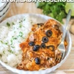 crockpot beef enchilada casserole in a bowl with rice.
