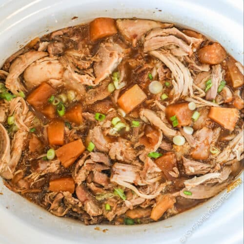 Finished pineapple pork recipe in a white crockpot.