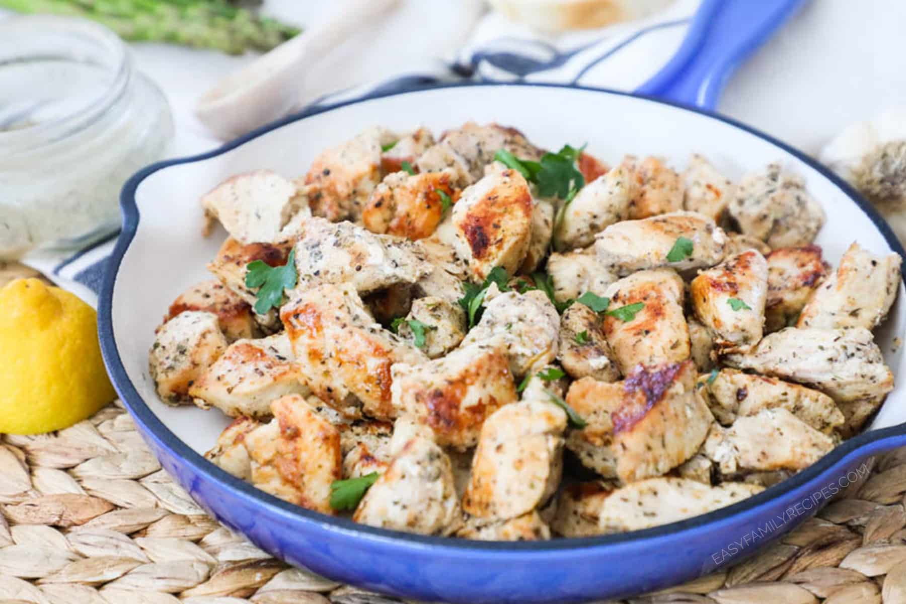 Greek chicken in a skillet that is fully cooked
