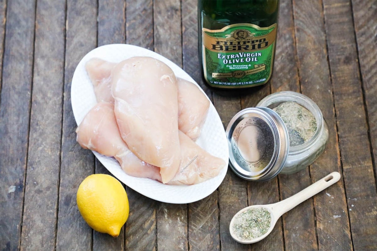 Ingredients to use for Greek chicken Bites - seasonings, lemon juice, chicken breasts, olive oil