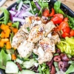 greek chicken bites served on a greek salad