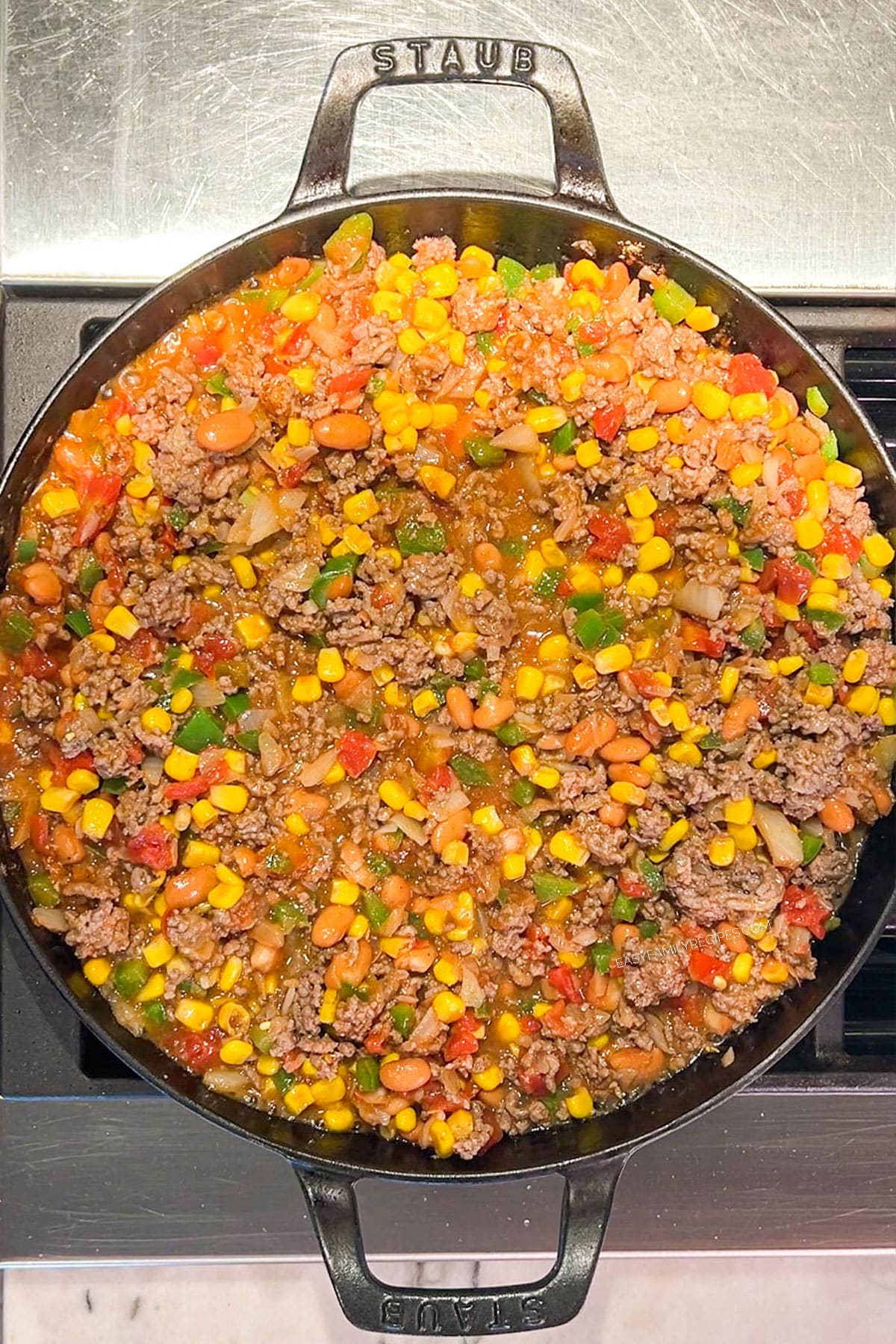 Step 4 of how to make Cowboy Casserole - mix and simmer