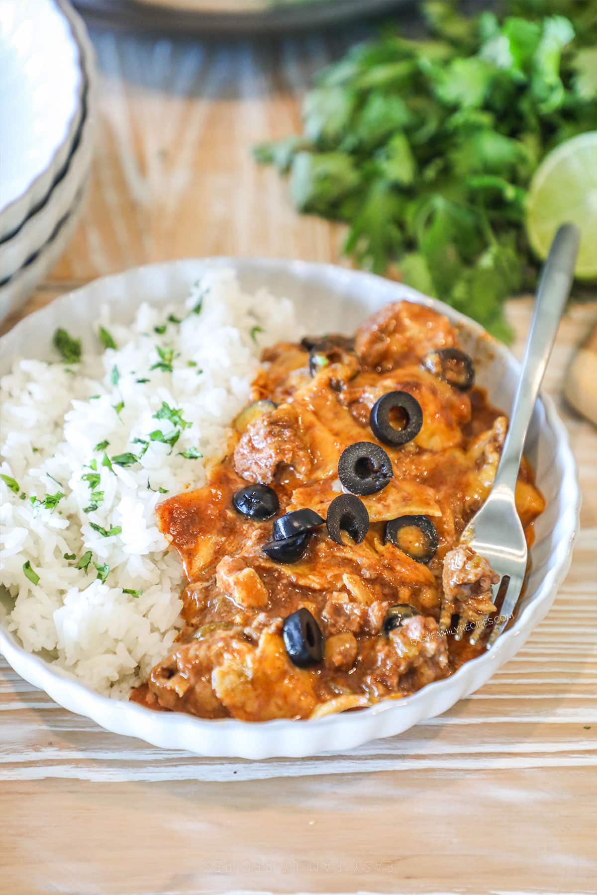 a bowl filled with beef enchilada casserole and rice.