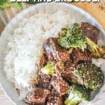 Top view of a white bowl full of Crockpot Beef and Broccoli over rice. The text reads, "Crockpot Beef and Broccoli"
