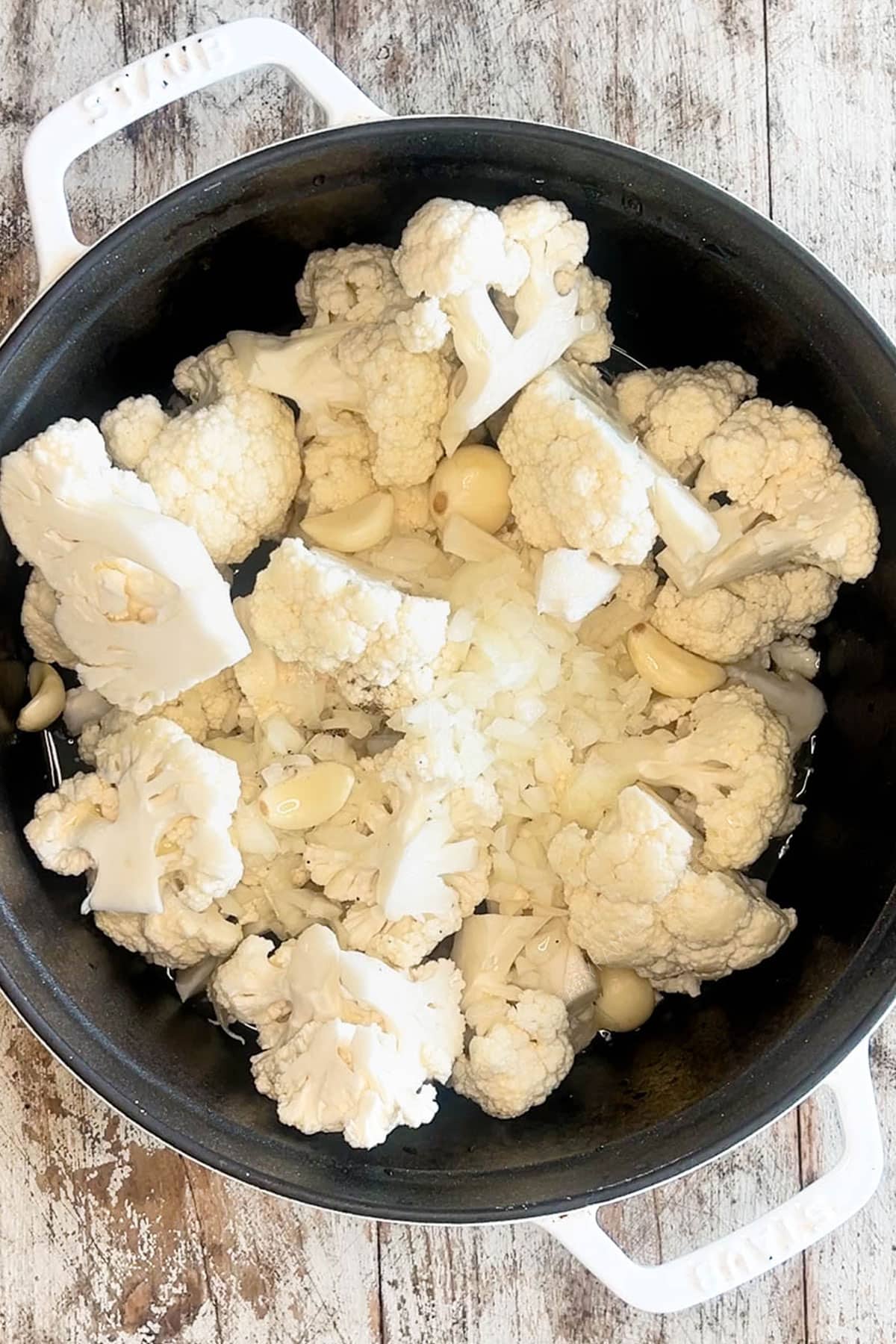 Cauliflower florets in a large pot.