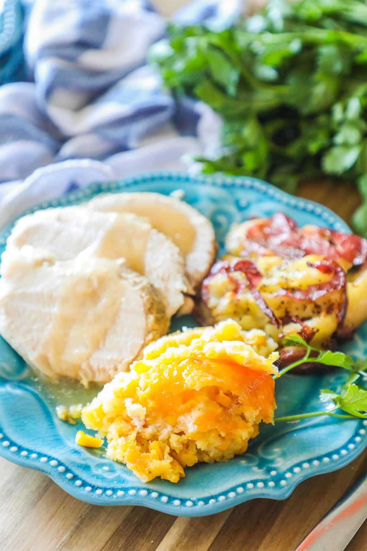 Jiffy Corn Casserole on a plate with turkey and gravy