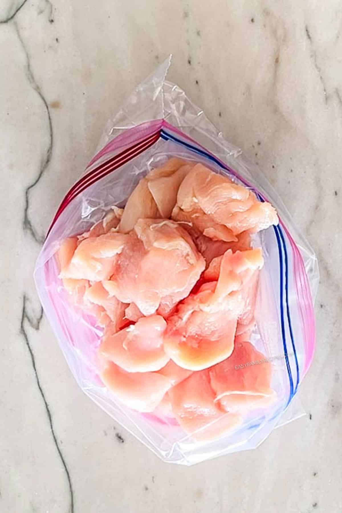 Pieces of chicken in a ziplock bag.
