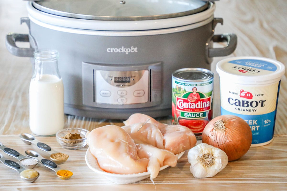 Ingredients needed to make slow cooker chicken tikka masala.