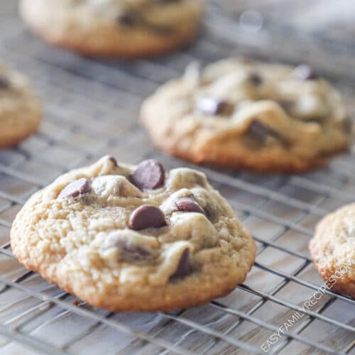 closeup of chocolate chip cookies on a cooling rack.