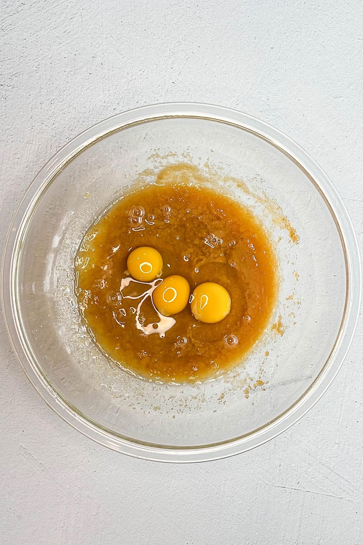 Eggs and vanilla added to the creamed butter mixture.