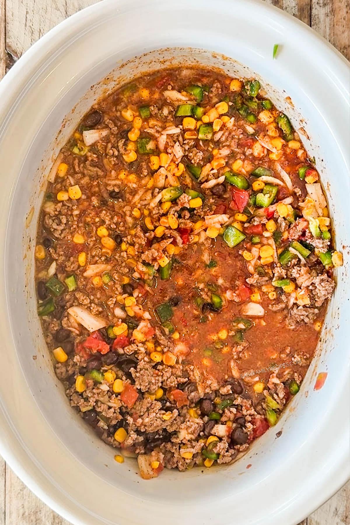 How to make Crockpot Taco Soup Step 3: Cover with beef broth and stir to combine