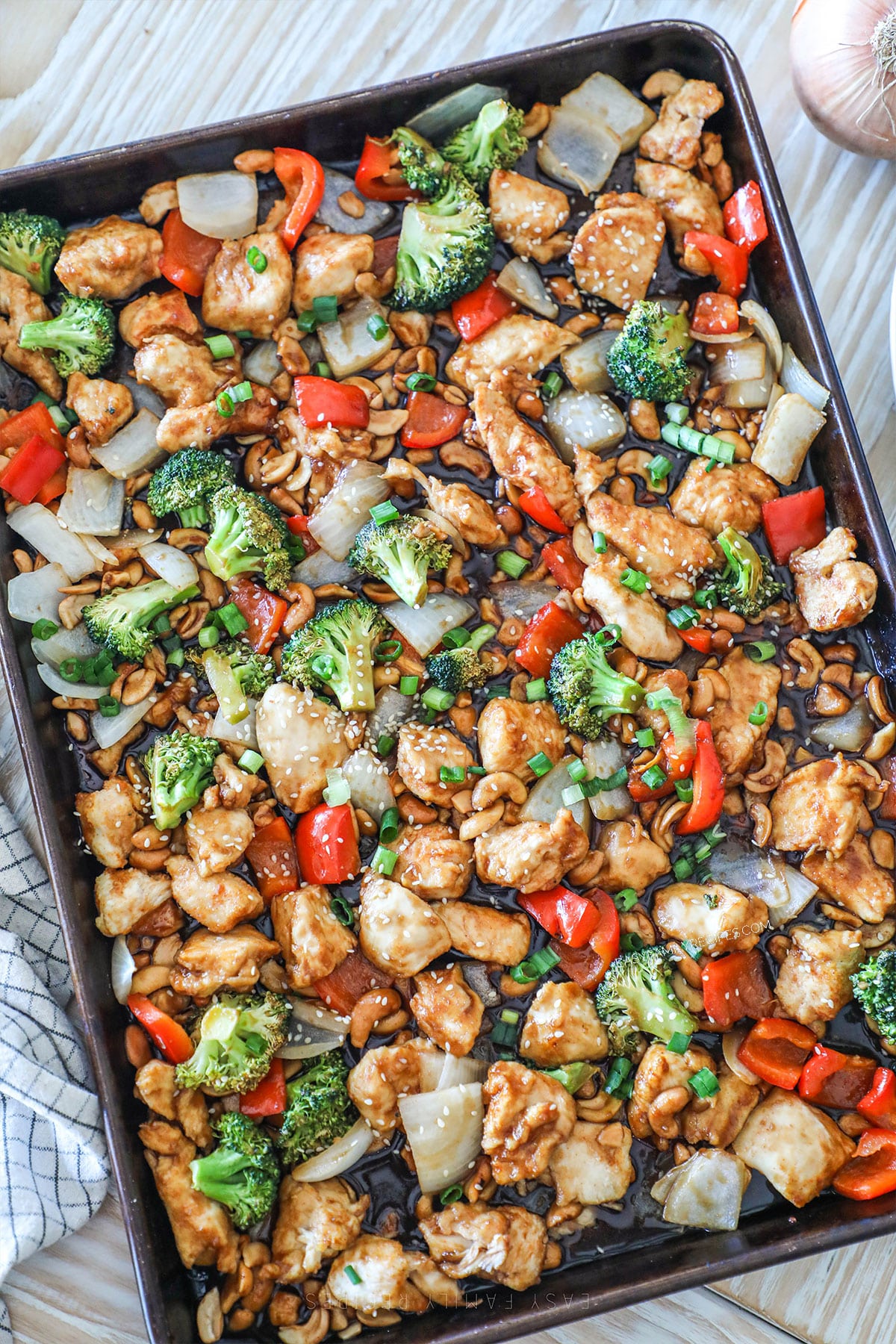 Sheet pan cashew chicken on a baking pan after cooking.